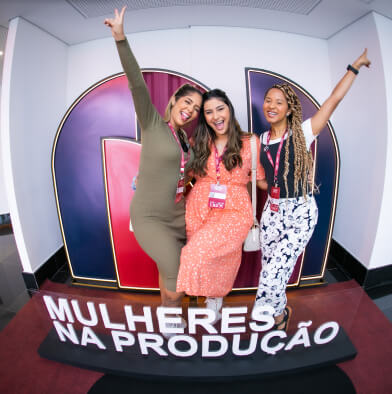 low view confident woman holding camera