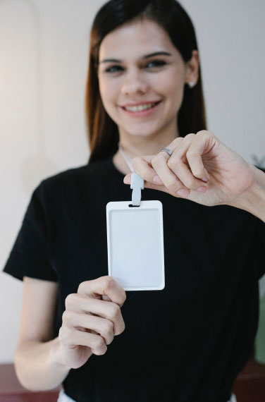 low view confident woman holding camera