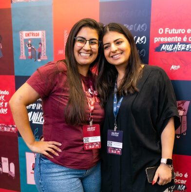 low view confident woman holding camera