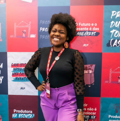 low view confident woman holding camera