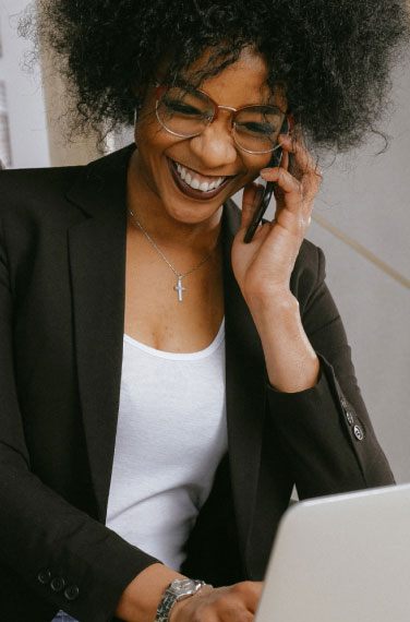 low view confident woman holding camera